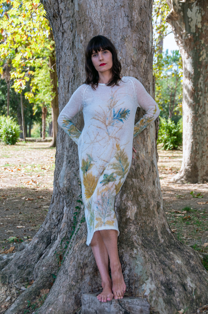 white handmade dress with green yellow and blue leaves