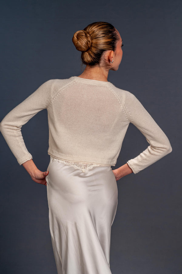 back view of small cardigan with long sleeves