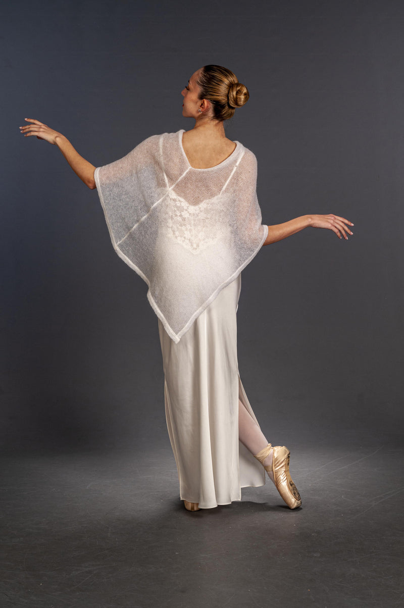 Back view of semi-transparent asymmetrical poncho for bride 
