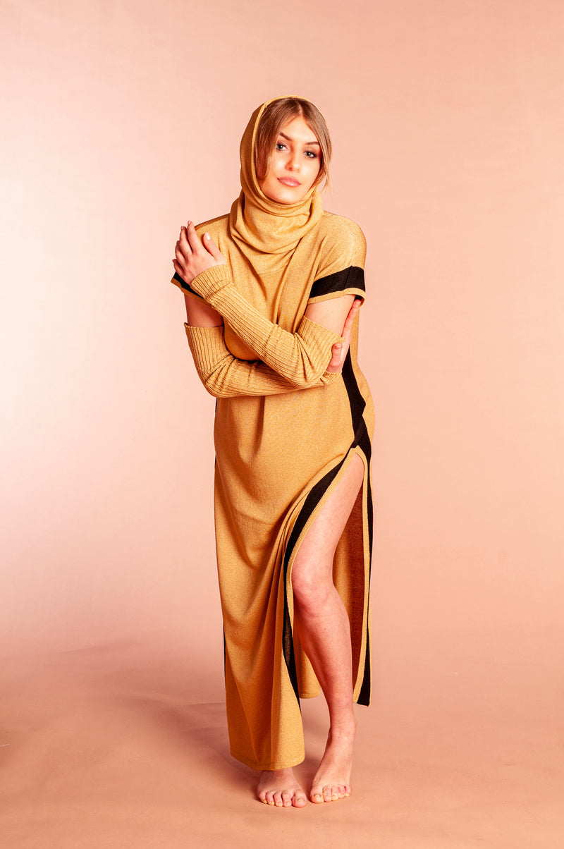 Sahara dress worn with hood and sleeves and long side slits