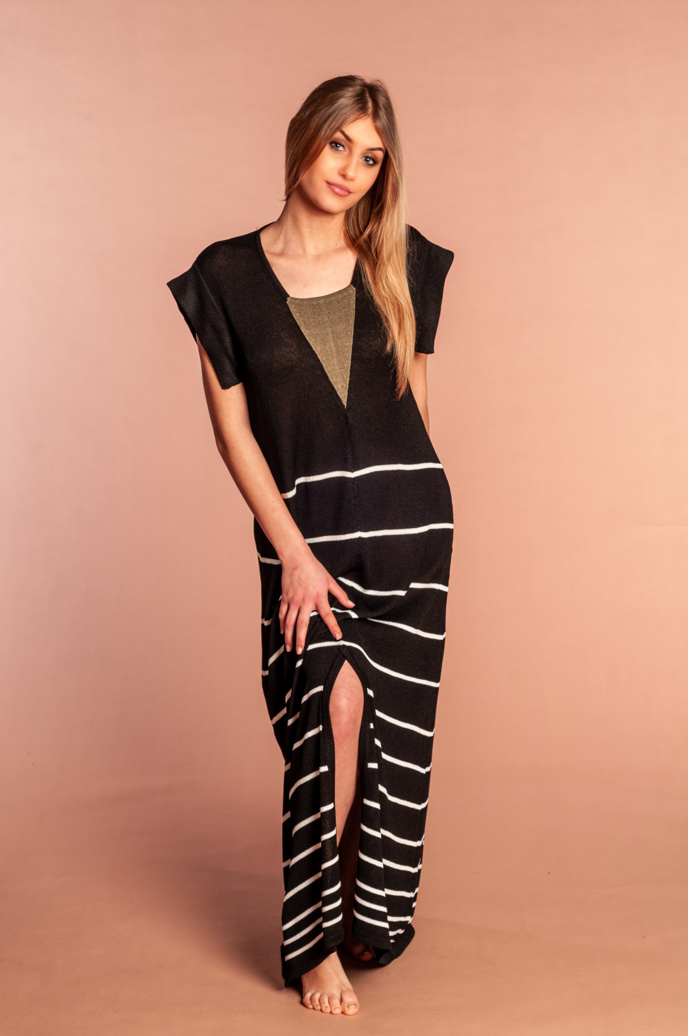 long black Mela Privé dress with white stripes and green detail